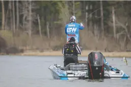  ?? Photo submitted ?? Q Mark Davis, of Mount Ida, works to boat a bass during his first day on the water in the Toro Stage One at Sam Rayburn Reservoir Monday. Davis leads Group B with 12 bass for 28 pounds, 2 ounces. Photo courtesy of Major League Fishing.