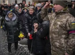  ?? EMILIO MORENATTI — THE ASSOCIATED PRESS ?? Anastasia, center, cries as soldiers carry the coffin of her brother, Oleg Kunynets, a Ukrainian military servicemen who was killed in the east of the country, during his funeral in Lviv, Ukraine, on Tuesday.