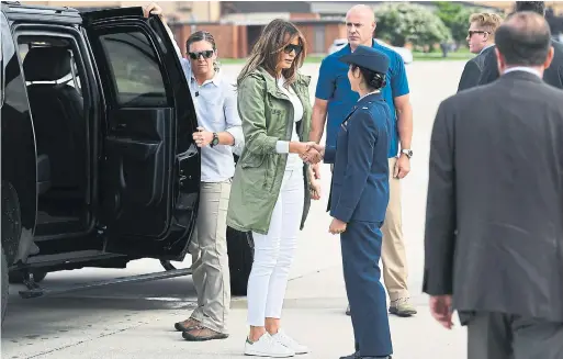  ?? MANDEL NGAN/AFP/GETTY IMAGES ?? Melania Trump wore the controvers­ial jacket a second time on the return trip from the shelter, as she arrived back at Andrew’s Air Force Base in Maryland.