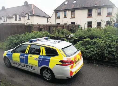  ??  ?? ON THE SCENE: Police at the house in Caol where the chainsaw attack took place