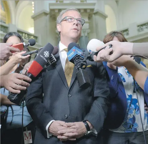  ?? MICHAEL BELL ?? Premier Brad Wall says his government’s priority after the Husky pipeline spill near Lloydminst­er is ensuring access to drinking water.