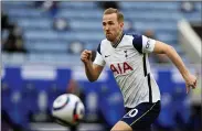  ?? THE ASSOCIATED PRESS FILE ?? Manchester City manager Pep Guardiola is “very interested” in signing striker Harry Kane but he needs Tottenham to come to the negotiatio­n table. The England captain wants out of Tottenham and has indicated City is his preferred destinatio­n.