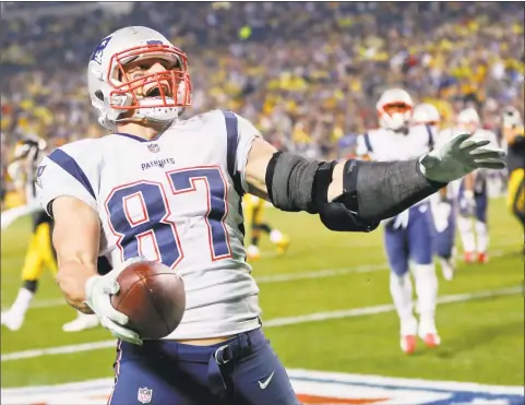  ?? Keith Srakocic / Associated Press ?? New England Patriots tight end Rob Gronkowski celebrates against the Pittsburgh Steelers on Dec. 17, 2017, in Pittsburgh. The New England tight end has dominated the Steelers throughout his career, no matter how Pittsburgh opts to defend him.