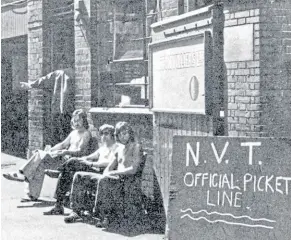  ?? ?? In total contrast, the gloom and doom at NVT is represente­d by these three pickets outside the gates of the firm’s troubled Wolverhamp­ton factory.