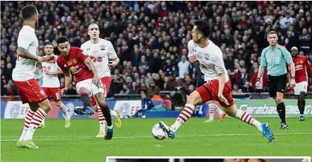  ??  ?? No escape: Jesse Lingard (third from left) scoring Manchester United’s second goal against Southampto­n in the English League Cup final on Sunday. Inset: Jose Mourinho holding aloft the League Cup. — Reuters