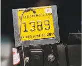  ??  ?? Above: The change has lowered the value of K medallions, taxi drivers say. Those drivers must wait significan­tly longer at SFO.