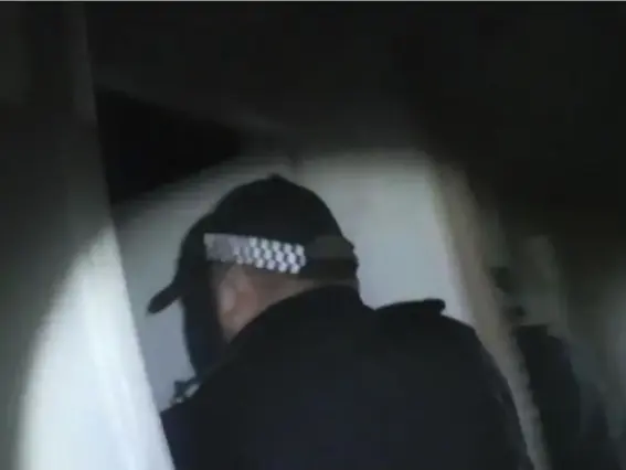  ??  ?? Officers raid a suspect’s property: over 200 people were arrested and weapons and drugs were seized over a week-long operation (Kent Police)