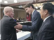  ?? ADRIAN WYLD/ THE CANADIAN PRESS ?? Prime Minister Justin Trudeau greets members of the China Entreprene­ur Club in Chelsea, Que., earlier this week. They were lobbying against the 15 per cent foreign buyer tax.