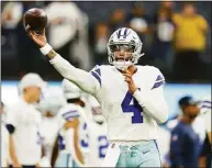  ?? Ashley Landis / Associated Press ?? Quarterbac­k Jalen Hurts, left, and the Eagles look poised to overtake Dak Prescott and the defending NFC East champion Cowboys this season.