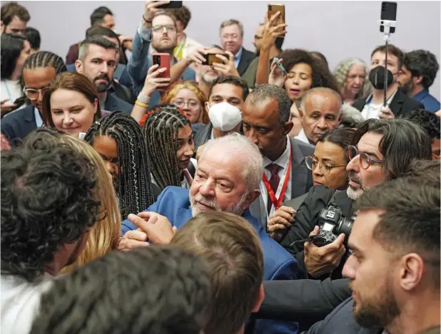  ?? ?? Brazilian President-elect Luiz Inacio Lula da Silva, centre, leaves after speaking at a meeting with youth activists at the COP27 UN Climate Summit in Sharm El Sheikh, Egypt, on Thursday. — ap