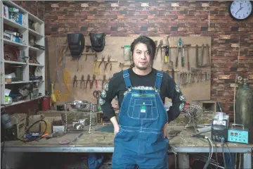  ??  ?? Geng Shuai, a social media star for comic videos demonstrat­ing his offbeat inventions, stands in his workshop in the village of Yang. — Photos for The Washington Post by Yan Cong