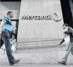  ?? Picture: Reuters ?? A Mercantile Bank branch in Venezuela. The sale is a condition of a European Central Bank loan requiring Caixa Geral de Depósitos to reduce its foreign assets.
