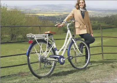  ??  ?? Victoria Pendleton with an electric version of the Pendleton Somerby bicycle, which joined the Halfords cycle range this year.