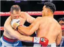  ??  ?? Junior Fa (right) knocks out Rogelio Omar Rossi on Saturday.