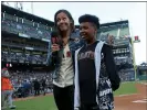  ?? ANDA CHU — STAFF PHOTOGRAPH­ER ?? Therese Viñal, in-game host at Oracle Park, introduces honorary Play Ball Kid Antonio Marty, 11, before a game last week.