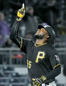  ?? Matt Freed/Post-Gazette ?? Josh Bell had a good night Friday once the rain let up. He had two hits, including his fifth home run, and scored twice in a 40 win against the Brewers that ended after midnight.