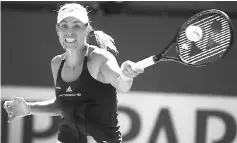  ?? — AFP photo ?? Angelique Kerber plays a forehand against Pauline Parmentier in their third round match during day eight of the BNP Paribas Open at Indian Wells Tennis Garden in Indian Wells, California.