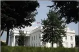  ?? ALEX BRANDON — ASSOCIATED PRESS ?? The American flag atop the White House files at half-staff Monday afternoon in memory of Sen. John McCain. Earlier in the day, it was at full-staff, drawing angry responses from both sides of the political aisle and from veterans.