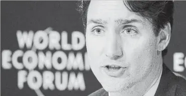  ?? PAUL CHIASSON THE CANADIAN PRESS ?? Prime Minister Justin Trudeau responds to a question during the closing news conference at the World Economic Forum.