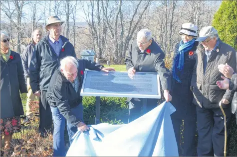  ?? KIRK STARRATT ?? Harry Morse and Allison Fisher officially unveil the Spirit of Somerset plaque at the Pleasant Valley Cemetery.