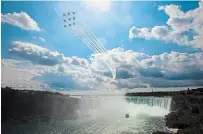  ?? BOB TYMCZYSZYN TORSTAR FILE PHOTO ?? Bob Tymczyszyn’s photo of the Red Arrows over Niagara Falls earned him an Ontario Newspaper Award.