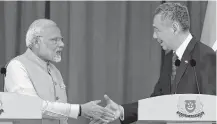  ??  ?? India’s Prime Minister Narendra Modi and Singapore's Prime Minister Lee Hsien Loong greet each other at the Istana presidenti­al palace in Singapore. AFP