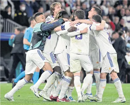  ?? AFP ?? Real Madrid players celebrate after winning the Champions League semifinal second leg match against Manchester City at the Santiago Bernabeu.