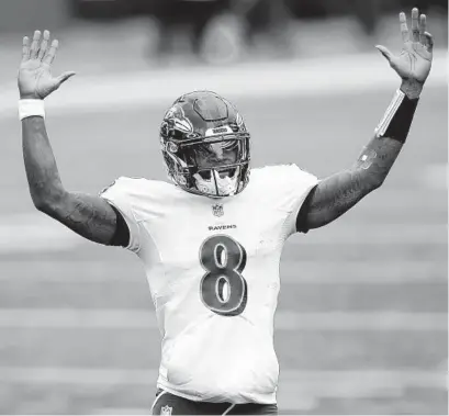  ?? AARONDOSTE­R/AP ?? Ravens quarterbac­k LamarJacks­on celebrates after running back J.K. Dobbins ran for a touchdown during Sunday’s game against the Bengals in Cincinnati.