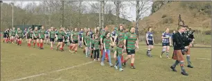  ??  ?? The teams were piped onto the pitch by John MacLeod and Iain MacPherson.