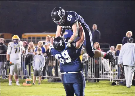  ?? Pete Paguaga / Hearst Connecticu­t Media ?? Ansonia’s Preston Dziubina is lifted up after scoring a touchdown against Seymour at Nolan Field on Thursday.