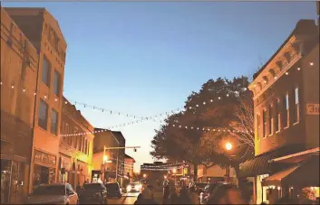  ?? / Contribute­d ?? Does this scene look familiar? It might look like downtown Cedartown from an odd angle, but it is actually the main street of Laurel, Miss. on a busy evening. It is this kind of crowd that local officials hope to get help to bring back to Polk County during a three-day tour from former stars of HGTV’s “Home Town” in September.