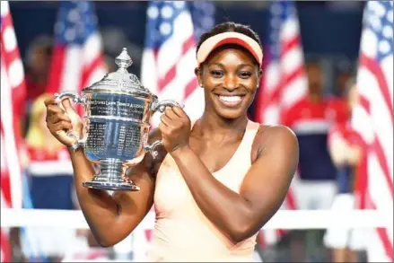  ?? TIMOTHY A CLARY/AFP ?? Sloane Stephens celebrates with the trophy after defeating Madison Keys in the 2017 US Open women’s singles final at the USTA Billie Jean King National Tennis Center in New York on Saturday.