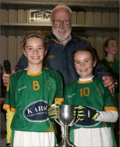  ??  ?? Joint captains Ciara Murphy and Mia Meyler with Kevin Waters.