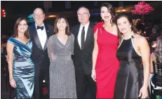  ??  ?? Barbara Putman and Peter Lane, Walton Arts Center CEO (from left); Masquerade Ball honorary chairwoman Judith McKenna and Phil Dutton; and Megan Timberlake and Jessica Hendrix, event co-chairwomen, welcome guests to the benefit in February at the arts center in Fayettevil­le.
(NWA Democrat-Gazette/Carin Schoppmeye­r)