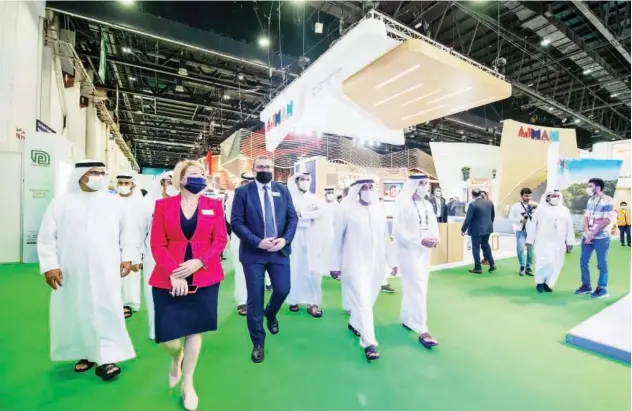  ?? ?? ↑ Sheikh Ahmed takes a tour after opening the Arabian Travel Market in Dubai on Monday.