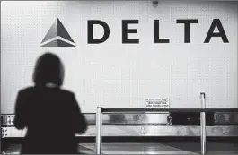  ?? SCOTT OLSON/GETTY ?? Delta is suspending flights to Moscow and paring capacity to Brazil, India and Africa.