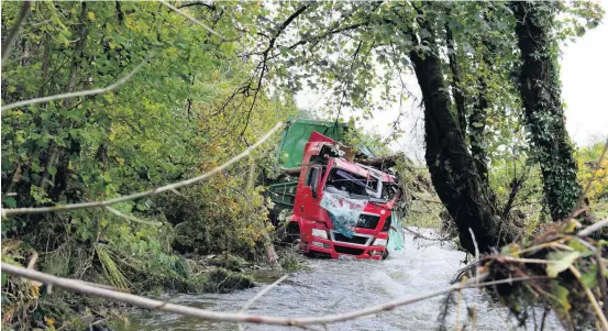  ?? Picture: Adrian White ?? The lorry has been cleared from the landslip site at the A484 at Cwmduad, Carmarthen­shire.