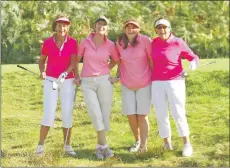  ??  ?? The pink ladies stop for a picture before teeing off at the 4th.