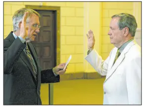  ?? Las Vegas Review-journal file ?? Senate Minority Leader Harry Reid, D-nev., will swears in ex-u.s. Rep. James Bilbray to the U.S. Postal Board of Governors in 2006.