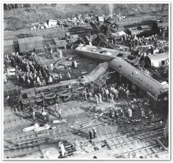  ?? GETTY IMAGES. ?? Onlookers line the boundary fence on March 23 1931, the day after the West Coast Main Line Leighton Buzzard crash that left six dead, including the driver and fireman. AWS would almost certainly have prevented this accident.