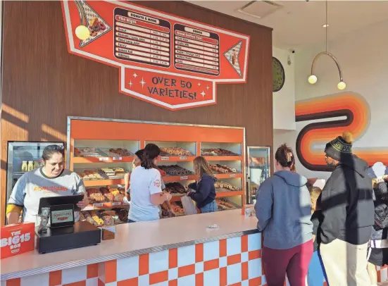  ?? RICHARD LANE/FOR THE REGISTER ?? Donutland opened its newest location in Urbandale with a roster of 50 varieties of doughnuts.