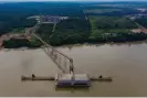  ?? Léo Corrêa/AP ?? A Cargill transshipm­ent port for soy and corn projects on the Tapajos River in Itaituba, Para state, Brazil, in 2019. Photograph: