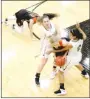  ??  ?? Prairie Grove seniors Lexie Madewell (left) and Larisha Crawford attempt to wrest the ball away from Gravette senior Jessica Bookout, who alertly grabbed a loose ball following a deflection by Gravette sophomore Kaylan Chilton, shown picking herself up after a collision with Madewell.