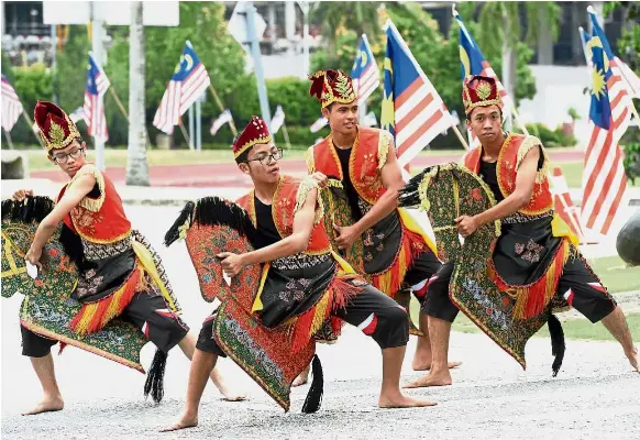  ??  ?? Sekolah Sultan Alam Shah (SAS) Putrajaya students Muhammad Hakimi, Adam Harith, Muhammad Adam, and Khairil Mirza (right to left), performing the kuda kepang dance. — DARRAN TAN/ The Star