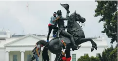  ?? (Tom Brenner/Reuters) ?? PROTESTERS ATTACH a chain to a statue of Andrew Jackson in front of the White House in Washington last summer.