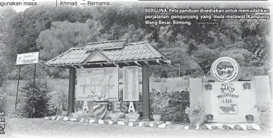  ?? — Gambar Bernama ?? BERGUNA: Peta panduan disediakan untuk memudahkan perjalanan pengunjung yang mula melawat Kampung Wang Besar, Bintong.