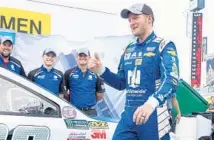  ?? STEPHEN M. DOWELL/STAFF PHOTOGRAPH­ER ?? Dale Earnhardt Jr. celebrates Friday after his qualifying run, which won him the pole for tonight’s CokeZero 400.