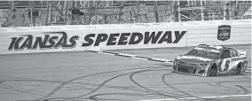  ?? DENNY MEDLEY/USA TODAY SPORTS ?? Kyle Larson (5) crosses the starting line of the Hollywood Casino 400 on Sunday at Kansas Speedway.