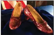  ?? (AP/Jeff Baenen) ?? A purloined pair of ruby slippers worn by Judy Garland in the “The Wizard of Oz” sit on display at a news conference in September 2018 at the FBI office in Brooklyn Center, Minn.