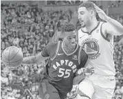  ?? Cole Burston / Canadian Press ?? Raptors guard Delon Wright, left, drives against Warriors guard Klay Thompson. Toronto lost for just the third time in 18 home games this season.